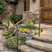 Hand forged iron railing for stone stairs, rustic outdoor stair railing.